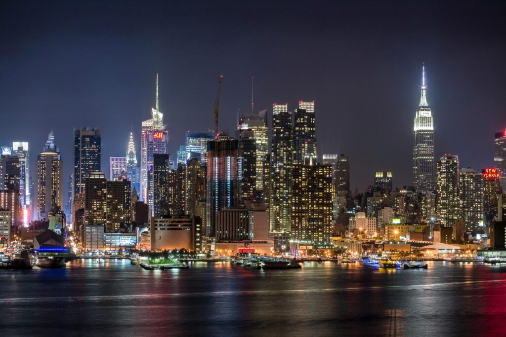 View of the New York City skyline at night, including the Empire State Building. Photo by Reynaldo Brigantty on Pexels.